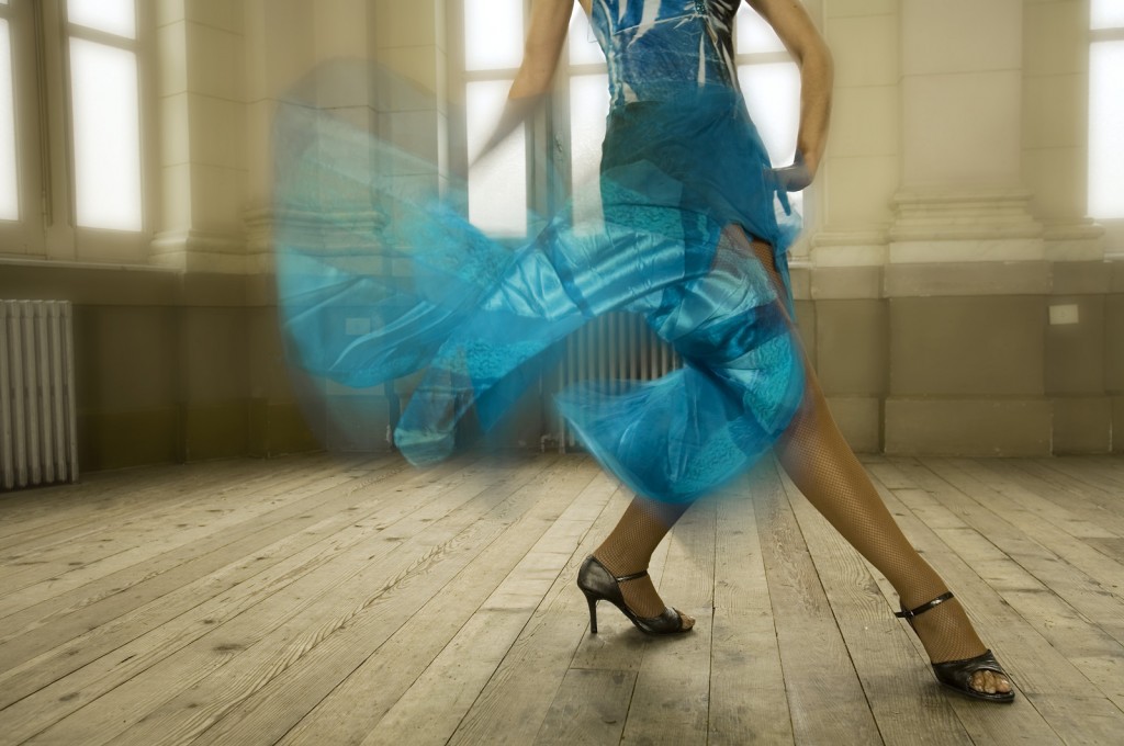 Dancer legs in a blue dress, in a Dance School hall, Buenos Aire